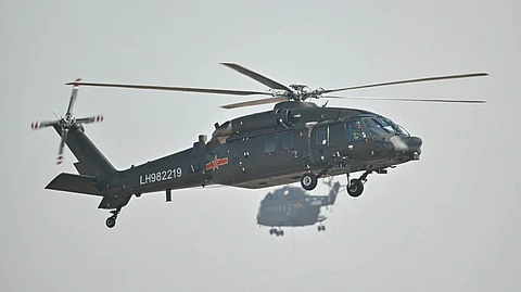 A Chinese Harbin Z-20 utility helicopter flies during the 15th China International Aviation and Aerospace Exhibition in Zhuhai, in south China's Guangdong province on November 12, 2024. The 15th China International Aviation and Aerospace Exhibition, held in the southern city of Zhuhai, will showcase military fighters, passenger jets, drones and weapons systems, some for the first time in public.