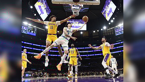 Lamelo Ball delivers down the stretch to lift the Charlotte Hornets to a 100-97 win over the Los Angeles Lakers in the NBA regular season.