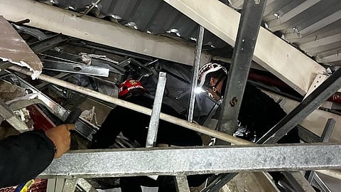 This handout picture released by La Libertad Police Region shows rescue teams working at the scene of an accident in which a roof of a food court collapsed in a shopping mall in Trujillo, Peru on 21 February 2025.