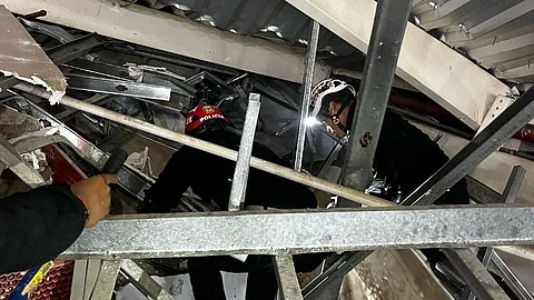 This handout picture released by La Libertad Police Region shows rescue teams working at the scene of an accident in which a roof of a food court collapsed in a shopping mall in Trujillo, Peru on 21 February 2025.