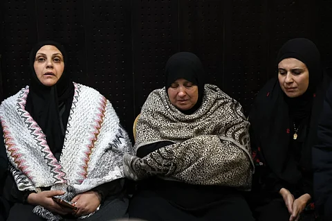 Palestinian families react after Israel delayed the release of Palestinian prisoners, scheduled to be released in the seventh hostage-prisoner exchange, in the occupied West Bank city of Ramallah early on February 23, 2025.
