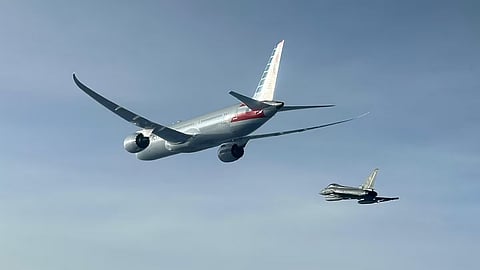 This picture taken by the Italian Air Force shows an American Airlines flight being escorted by a Eurofighter following an alleged bomb scare.