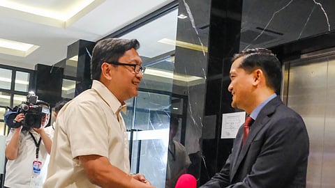 OUTGOING PCO Secretary Cesar Chavez (left) turns over the post to fellow veteran broadcaster Jay Ruiz on Monday in the presence of Palace reporters and photographers.
