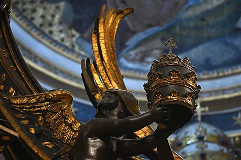 A photograph shows a detail of St Peters' baldachin, a large Baroque sculpted bronze canopy over the high altar of St. Peter's Basilica during a mass for Sunday of the Word of God on January 21, 2024 in The Vatican. The baldachin above the main altar, marks the place of the Tomb of the Apostle Peter to whom the Basilica of St. Peter is dedicated and should be restored before the 2025 Jubilee wanted by Pope Francis.