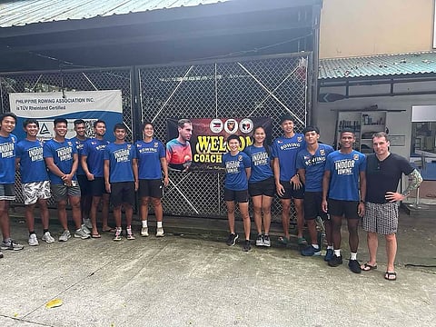 German coach Benedikt Schwarz (right) gets a warm welcome from Filipino rowers.