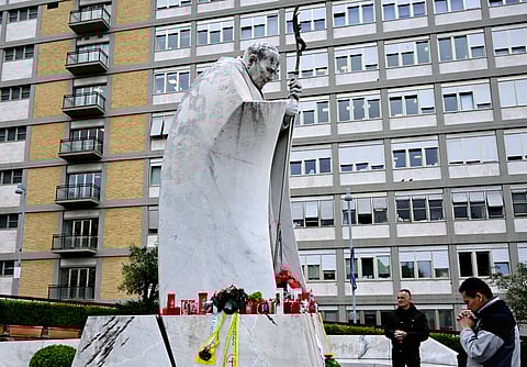 Pope in prayers Like countless Cathokics around the world, a man prays at the statue of John Paul II outside the Gemelli hospital where Pope Francis has been hospitalized for double pneumonia in Rome. Pope Francis, 88, entered his 11th day at the Gemelli hospital in Rome, making this the longest hospitalization of his papacy.