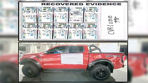 Authorities present the confiscated evidence from a man who was arrested after posing as a National Bureau of Investigation agent who extorted P10 million from a Chinese businessman.