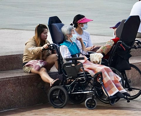 Caregiver resting with an employer in Kaohsiung.