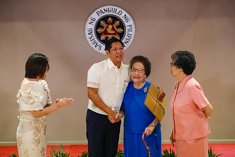 Hiwaga Domiguez, 101 years old receives a cash gift handed by President Ferdinand R. Marcos Jr. during the inaugural cash gift distribution under the Expanded Centenarians Act of 2024 on 26 February 2025, at Heroes Hall, Malacañan Palace.