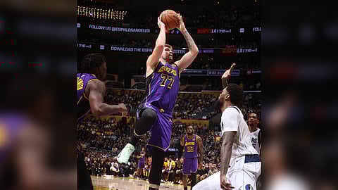 Luka Doncic dazzles with a triple-double performance to lift the Los Angeles Lakers to a 107-99 victory over the Dallas Mavericks in the NBA regular season.