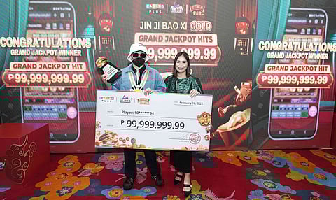 Casino Plus representative presents the Jin Ji Bao Xi Gold Grand Jackpot check.