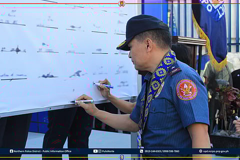 NCRPO Chief Brigadier General Anthony Aberin signing in the solidarity pact for the 2025 polls