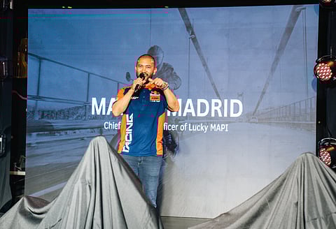 Martin Madrid, chief operating officer of Lucky MAPI, energizes the crowd at the KTM and Husqvarna launch event.