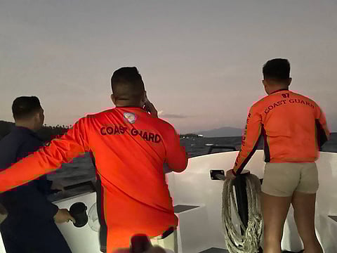 Members of the Philippine Coast Guard patrol the seas of Verde Island following the incident where two divers died after being attacked by a shark.