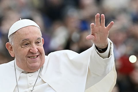 (FILES) Pope Francis waves to the crowd during the weekly general audience on 20 March 2024 at St Peter's Square in The Vatican.
