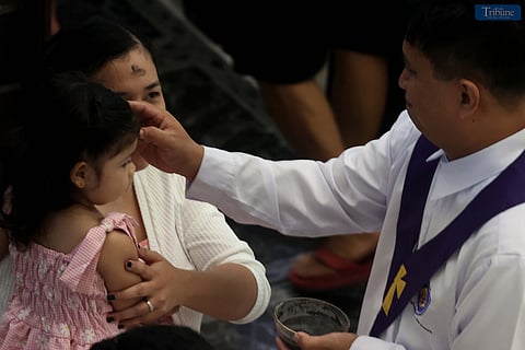 On Wednesday, 5 March 2025, devotees line up to receive ash on their foreheads during Mass at St. Peter Parish: Shrine of Leaders along Commonwealth Avenue in Quezon City in observance of Ash Wednesday. The occasion serves as a solemn reminder of human mortality and the need for reconciliation with God, marking the beginning of the penitential Lenten season.