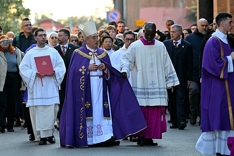 Italian cardinal Angelo De Donatis (C) arrives with a procession at the Church of Saint Sabina in Rome during the celebration of Ash Wednesday mass on 5 March 2025. Pope Francis's condition was stable on 5 March 2025 as he neared three weeks in hospital battling pneumonia, a Vatican source said, with celebrations for the Lent religious season starting without him.