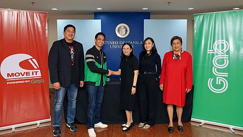Grab Philippines and MOVE IT partnered with the Ateneo Bulatao Center for Psychological Services to develop evidence-based, behavior-focused assessment and training. The agreement was sealed among (from left) Wayne Jacinto, MOVE IT general manager; EJ dela Vega, Grab Philippines director for Mobility; Eloisa D. Balmoris, Ateneo vice president for Finance and treasurer; Maria Lourdes Mesa, Ateneo Bulatao Center for Psychological services director for Research; and Dr. Maria Isabel E. Melgar, head research proponent.