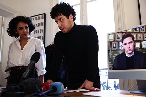 The family lawyer Chirinne Ardakani (L), Ali Rahmani (C), son of Narges Mohammadi, and head of the Norwegian Nobel Committee, Jorgen Watne Frydnes (on screen) hold a press conference after Iranian Nobel Peace Prize winner Narges Mohammadi, who has been incarcerated in Tehran since November 2021, was temporarily released from prison on medical grounds, in Paris, on 4 December 2024. Iranian authorities on December 4 freed Nobel peace prize winner Narges Mohammadi from prison for three weeks on medical grounds, a move supporters decried as "too little too late" with the Nobel committee urging a permanent release.