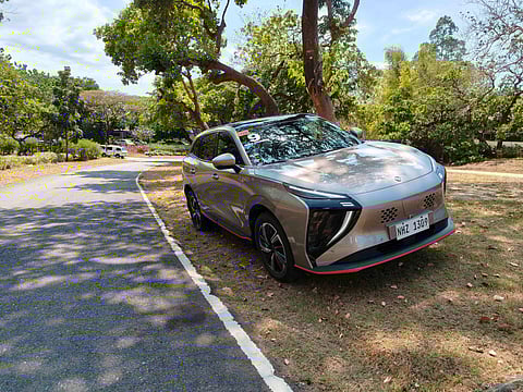 The Forthing Friday takes a breather under the shade after a long drive, showcasing its futuristic design and electric prowess.