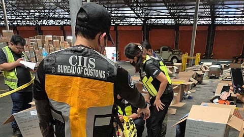 Personnel of Customs Intelligence and Investigation Service inspect the P29 million worth of suspected marijuana and kush oil hidden in two balikbayan boxes that arrived at the Manila International Container Port (MICP) last Friday.