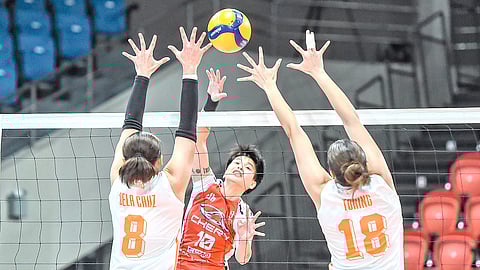 Ara Galang refuses to get intimidated as she attacks two Farm Fresh defenders to lead Chery Tiggo to a 29-27, 15-25, 25-22, 25-21 victory in the Play-in phase of the PVL All-Filipino Conference on Tuesday.