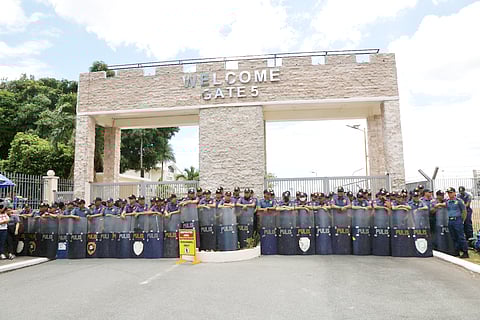 GATE 5 of Villamor Air Base in Pasay City is guarded tightly by police civil disturbance units to prevent supporters of the arrested former President Rodrigo Duterte from interfering with his scheduled flight to The Hague as ordered by the International Criminal Court to face alleged crimes against humanity in relation to his war on drugs.