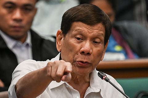 (FILES) Former Philippine president Rodrigo Duterte gestures as he attends a senate probe on the drug war during his administration, in Manila on 28 October 2024. Former Philippines president Rodrigo Duterte was arrested on 11 March 2025 after landing at Manila's international airport by police acting on an International Criminal Court warrant over his deadly war on drugs, the presidential palace said.