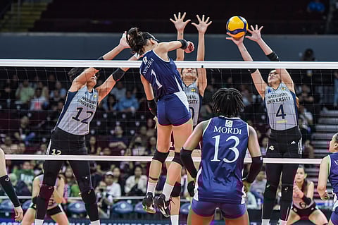 The NU Lady Bulldogs tighten their defensive screws at the net to frustrate Shaina Nitura and the Adamson Lady Falcons, 25-21, 25-23, 25-18, in the UAAP Season 87 women’s volleyball tournament yesterday.