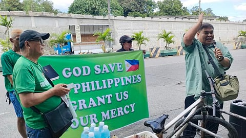 Ranque (with cap) during the 23 February "God Bless the Philippines" prayer rally near People Power monument along EDSA, Quezon City.