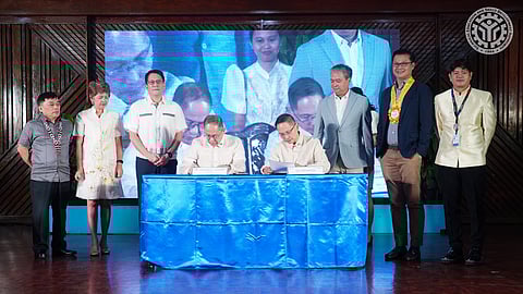 Labor Secretary Bienvenido Laguesma and TESDA Director General Jose Francisco “Kiko” Benitez sign the implementing rules and regulations of the Enterprise-Based Education and Training (EBET) Framework Act (Photo by TESDA)