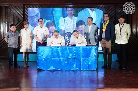 Labor Secretary Bienvenido Laguesma and TESDA Director General Jose Francisco “Kiko” Benitez sign the implementing rules and regulations of the Enterprise-Based Education and Training (EBET) Framework Act (Photo by TESDA)