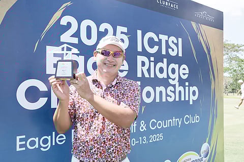 Angelo Que lifts the trophy after clinching his second consecutive PGT title following a victorious performance in the ICTSI Eagle Ridge Championship.