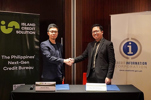 Hongcheng (Steven) Zhou, Deputy CEO of Island Credit Solution (left) shake hands with CIC President and CEO Ben Baltazar (right) during the signing ceremony recently held at the Grand Hyatt Manila in Taguig City.