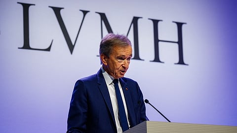 (FILES) Head of top luxury conglomerate LVMH Bernard Arnault presents the group's 2024 annual results in Paris, on 28 January 2025. LVMH will propose at its annual general meeting to raise the CEO retirement age from 80 to 85, allowing Bernard Arnault, 76, to remain at the helm of the world's leading luxury goods company for longer.