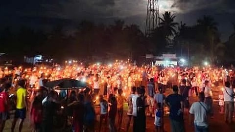 People converge at the town of Las Nieves, Agusan del Norte Saturday night holding candles, praying for return of FPRRD.