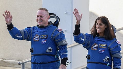 NASA’s Boeing Crew Flight Test Commander Butch Wilmore (L) and Pilot Suni Williams walk out of the Operations and Checkout Building on 5 June 2024 in Cape Canaveral, Florida.