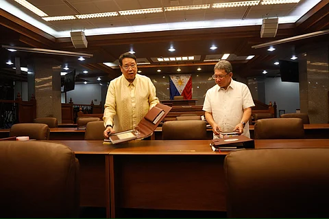 Senate secretary Renato Bantug and House of Representatives Secretary Reginald Velasco inspects the Senate session hall, which has been converted into an impeachment court, in advanced for Vice President Sara Duterte’s impeachment trial at the Senate of the Philippines on 18 March, 2025 in Pasay, City.