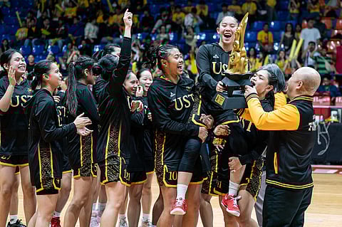 The UST Junior Growling Tigresses celebrate after pulling off a 63-57 win over the NUNS Lady Bullpups to capture the Season 87 UAAP girls’ basketball tournament title on Thursday.