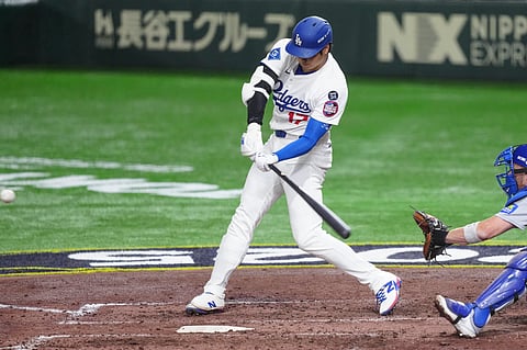 Shohei Ohtani hits a home run in the fifth inning to help the Los Angeles Dodgers complete a two-game sweep of the Chicago Cubs in the MLB season opener.