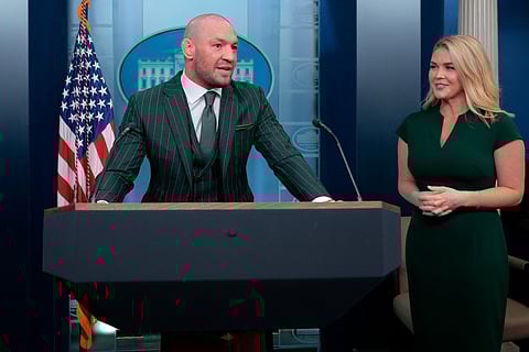 WASHINGTON, DC - 17 MARCH: Former UFC champion and Irish businessman Conor McGregor briefly speaks with reporters alongside White House Press Secretary Karoline Leavitt before meeting with President Donald Trump in the Brady Press Briefing Room at the White House on Saint Patrick's Day, 17 March, 2025 in Washington, DC. McGregor said he is meeting with Trump to talk about how Ireland is losing its identity to immigrants, among other topics.