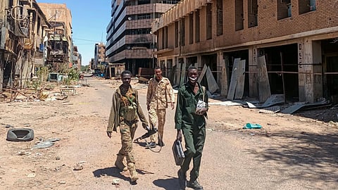 Fighters loyal to the Sudanese army patrol a street in Khartoum on March 24, 2025