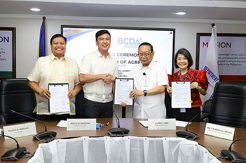 The Manila International Airport Authority can now decide whether to buy or rent the 61-hectare Ninoy Aquino International Airport Terminal 3. Showing the signed memorandum of agreement were (from left) Bases Conversion and Development Authority chair Hilario Paredes, BCDA president and CEO Engr. Joshua Bingcang, MIAA general manager Eric Jose Ines and MIAA senior assistant general manager Ma. Lourdes Reyes.