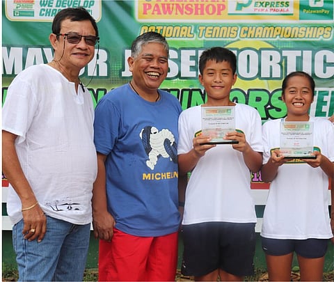 AYL Gonzaga (right) beams as she and Julius Otoc hold their trophies after clinching MVP honors in the PPS-PEPP national juniors tennis in Davao del Sur. Also shown are (from left) Digos Tennis Club officer Paul Basan and Ray Anthony Loyola, organizer and consultant for City Sports Development.