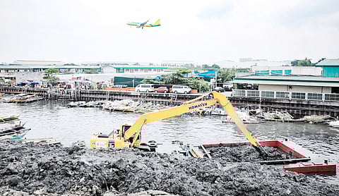 Workers from the NNIC collect a total of 139,158 metric tons of silt and debris from the river channels surrounding the Ninoy Aquino International Airport in Parañaque City as part of an ongoing cleanup of the firm.