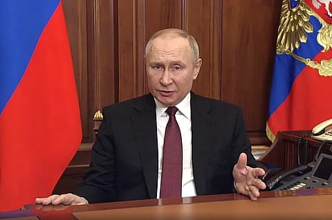 In this video grab taken from footage made available on February 24, 2022 on the official website of the Russian president (kremlin.ru) President Vladimir Putin addresses the nation at the Kremlin in Moscow