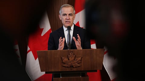 Canada's Prime Minister Mark Carney speaks to the media after meeting with his cabinet to deal with the US auto tariffs on March 27, 2025