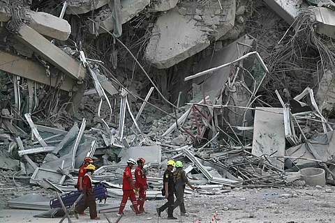 Race to find survivors A rescue worker attempts to extract a mother and her child from a collapsed building in Naypyidaw on 28 March following an earthquake in central Myanmar that buckled roads and collapsed buildings even in neighboring Thailand. The death toll from the powerful temblor is expected to rise in the country also wracked by an ongoing civil war.