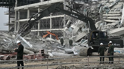 Machinery is used to remove debris from the site of an under-construction building collapse in Bangkok on March 29, 2025, a day after an earthquake struck central Myanmar and Thailand. Rescuers dug through the rubble of collapsed buildings on March 29 in a desperate search for survivors after a huge earthquake hit Myanmar and Thailand, killing more than 150 people.