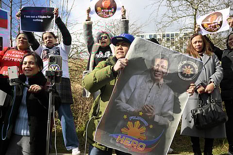 Protestors demonstrate in support of former Philippines president Rodrigo Duterte in front of the International Criminal Court.